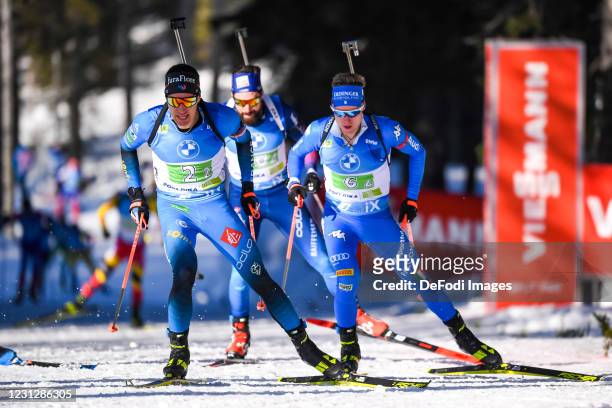 Quentin Fillon Maillet of France and Lukas Hofer of Italy in action competes during the Men 4x7.5 km Relay Competition at the IBU World Championships...