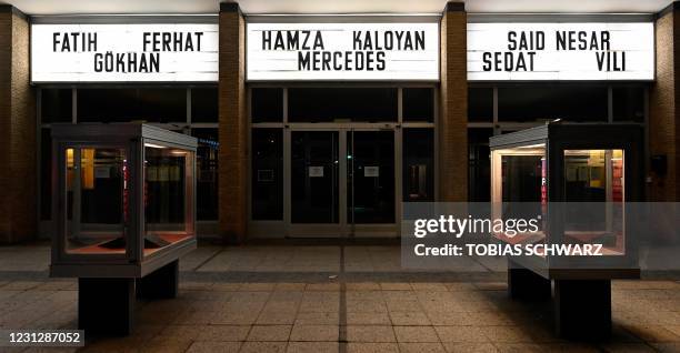 The names of the nine victims of the deadly 2020 Hanau shootings are displayed outside the Kino International cinema in Berlin on February 20 a day...