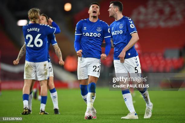 Everton's English midfielder Tom Davies, Everton's French defender Lucas Digne, Everton's English midfielder Ben Godfrey and Everton's English...