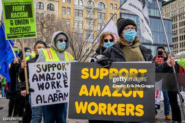 Participants seen holding signs and marching on a picket line at the protest. Members of the Workers Assembly Against Racism gathered across from...