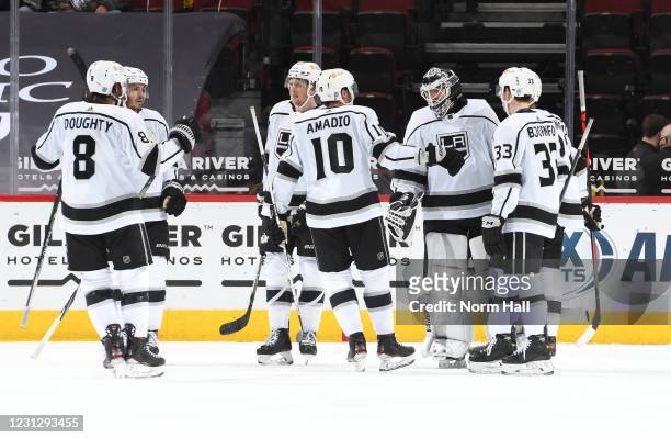 Goalie Calvin Petersen of the Los Angeles Kings is congratulated by Drew Doughty, Matt Roy, Michael Amadio, Austin Wagner and Tobias Bjornfot...