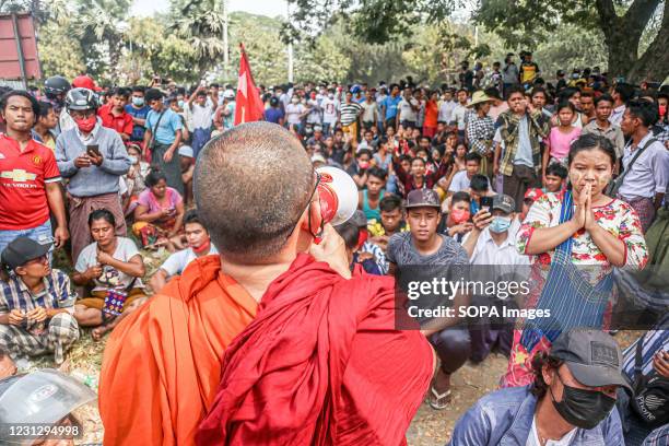 Monk is talking to the crowd during a peacful demonstration against the military coup. Anti-military coup protesters took to the streets of Mandalay...