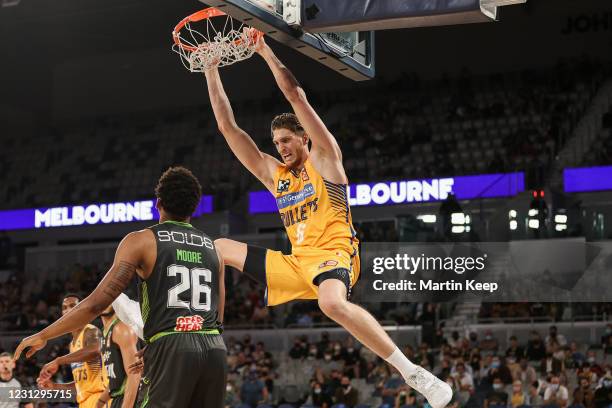 Matt Hodgson of the Bullets dunks the ball during the NBL Cup match between the South East Melbourne Phoenix and the Brisbane Bullets at John Cain...