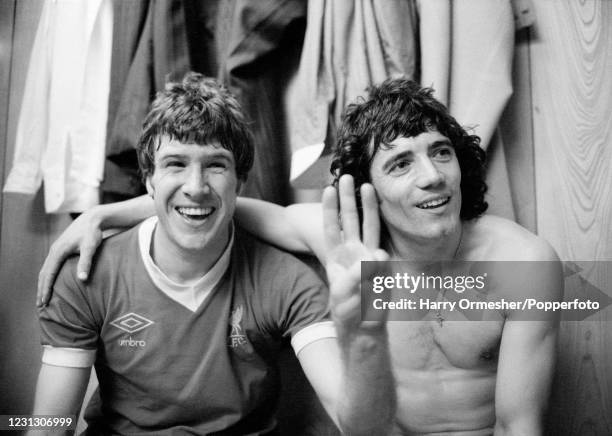 Emlyn Hughes and Kevin Keegan of Liverpool celebrate in the dressing room after the FA Cup Semi Final replay between Liverpool and Everton at Maine...