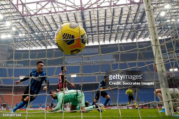 Lautaro Martinez of FC Internazionale scores his team's second goal during the Italian Serie A match between AC Milan v Internazionale on February...