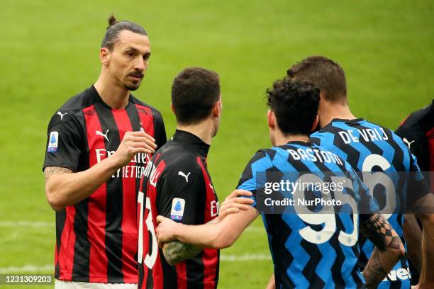 Zlatan Ibrahimovic of AC Milan and Alessandro Bastioni of FC Internazionale during the Serie A match between AC Milan and FC Internazionale at Stadio...