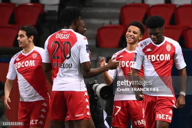 Monaco's French midfielder Sofiane Diop is congratulated by teammates after scoring a goal during the French L1 football match between Paris-Saint...