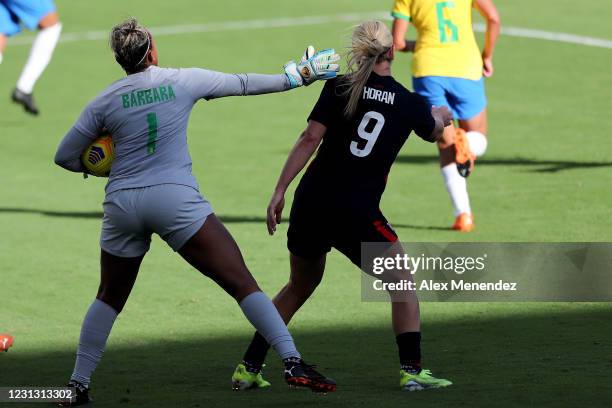 Barbara of Brazil slaps at Lindsey Horan of United States during the second half of the SheBelieves Cup at Exploria Stadium on February 21, 2021 in...