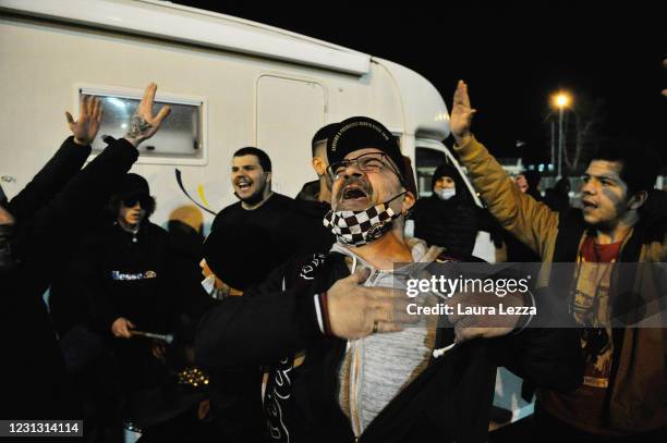 Fans of the Serie C team of Livorno Calcio gather to support their team outside the stadium, which is closed to the public due to Covid-19 on...