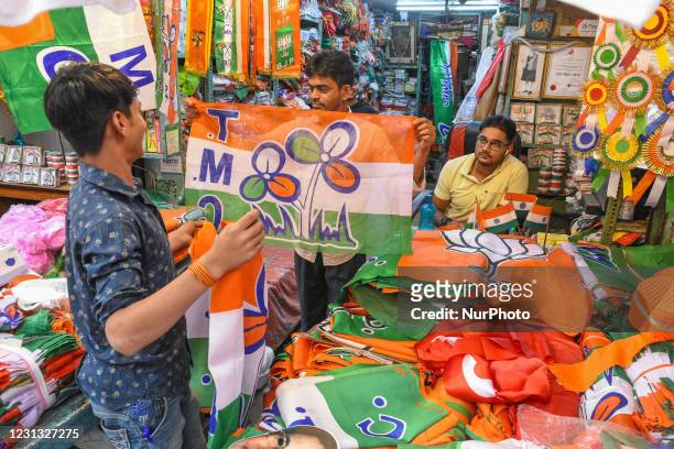 Shop owners at flag stores in Kolkata are busy making and packing flags for sale of various political parties, in Kolkata, India, on February 22,...