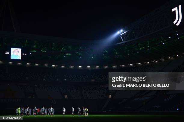 Players hold a minute's silence in homage to late Italian international footballer Mauro Bellugi prior to the Italian Serie A football match Juventus...