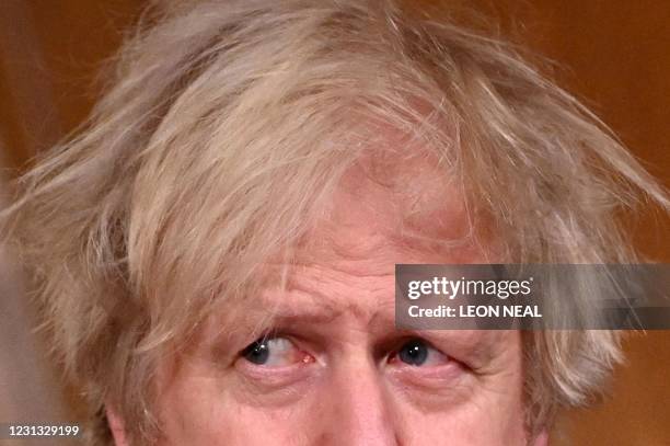 Britain's Prime Minister Boris Johnson attends a virtual press conference inside 10 Downing Street in central London on February 22 after he earlier...
