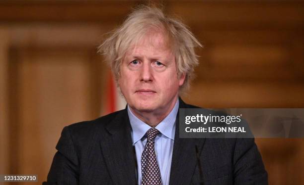 Britain's Prime Minister Boris Johnson attends a virtual press conference inside 10 Downing Street in central London on February 22 after he earlier...