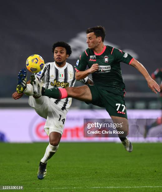 Weston McKennie of Juventus challenged by Milos Vulic of FC Crotone during the Serie A match between Juventus and FC Crotone at Allianz Stadium on...