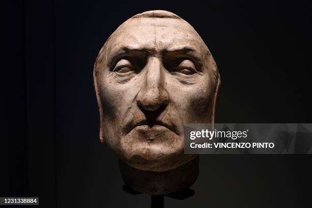 Photo taken on February 23, 2021 at the Palazzo Vecchio in Florence shows a recreated death mask of Italian poet, writer and philosopher Dante...