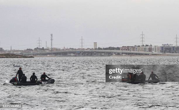 Rescue divers conduct search operations for victims of a capsized boat in Lake Mariout, 20 kilometres west of Egypt's second city of Alexandria on...