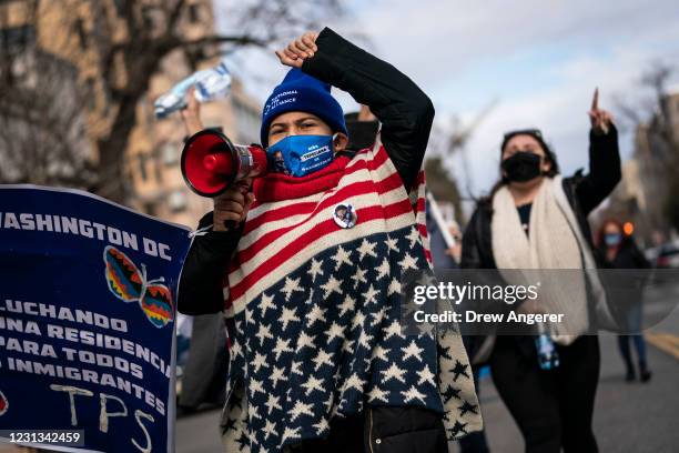Activists and citizens with temporary protected status march along 16th Street toward the White House in a call for Congress and the Biden...