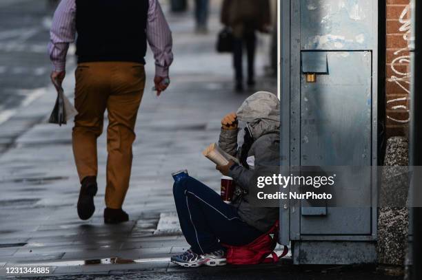 Beggar seen in Dublin city center during Level 5 Covid-19 lockdown. The Taoiseach Micheal Martin has just confirmed the extension of Ireland's Level...