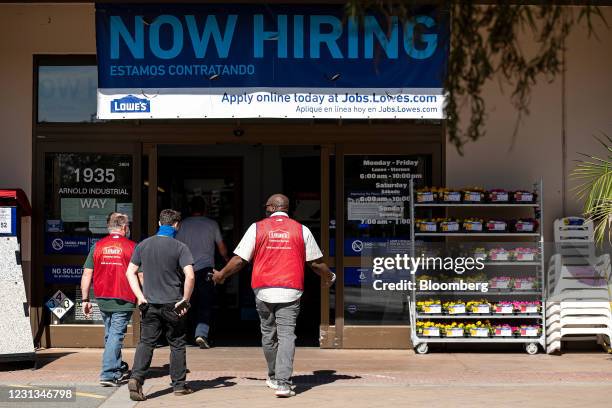 Now Hiring" sign outside a Lowe's store in Concord, California, U.S., on Tuesday, Feb. 23, 2021. Lowe's Cos Inc. Is expected to release earnings...