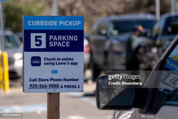 Curbside Pickup" sign in the parking lot of a Lowe's store in Concord, California, U.S., on Tuesday, Feb. 23, 2021. Lowe's Cos Inc. Is expected to...