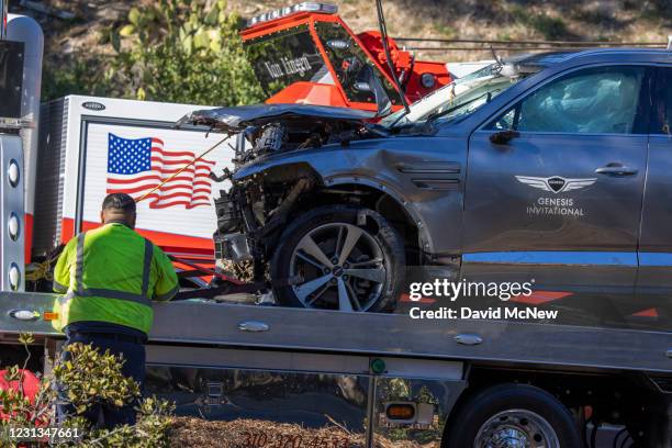 Sign for the Genesis Invitational golf tournament is seen on the door of the car that golf legend Tiger Woods was driving when seriously injured in a...