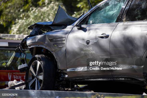 Sign for the Genesis Invitational golf tournament is seen on the door of the car that golf legend Tiger Woods was driving when seriously injured in a...