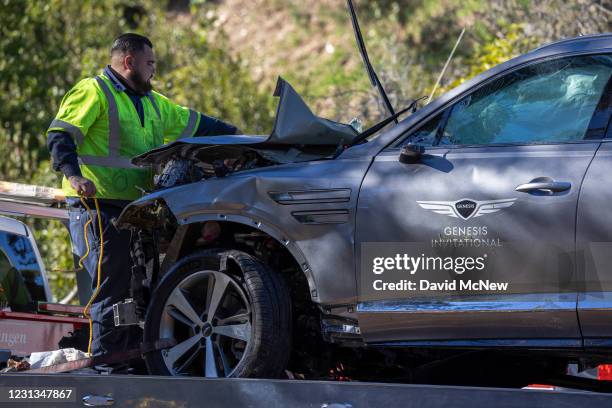 Sign for the Genesis Invitational golf tournament is seen on the door of the car that golf legend Tiger Woods was driving when seriously injured in a...