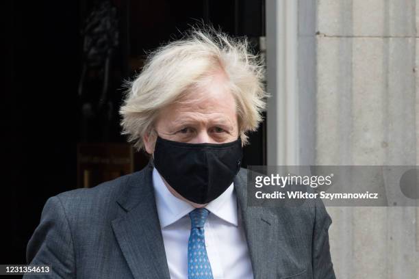 British Prime Minister Boris Johnson leaves 10 Downing Street for PMQs at the House of Commons on 24 February, 2021 in London, England. The...