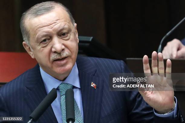 Turkish President and leader of the Justice and Development Party Recep Tayyip Erdogan delivers a speech during a meeting of members of the AK Party...