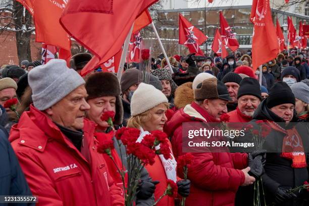 Communist Party leader Gennady Zyuganov and members of the Communist Party Central Committee seen with Carnations during the rally. The Communist...