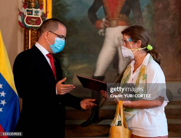 Venezuela's Foreign Minister Jorge Arreaza gives a letter to European Union's ambassador to Caracas Isabel Brilhante after a meeting in Caracas on...