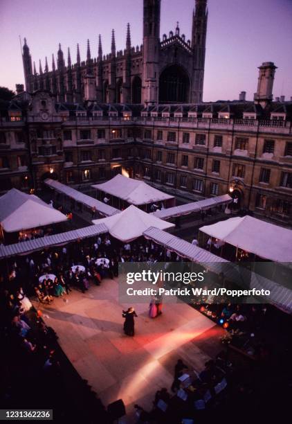 The dance floor in the courtyard of Clare College, Cambridge University in England during its May Ball, with King's College Chapel in the background,...