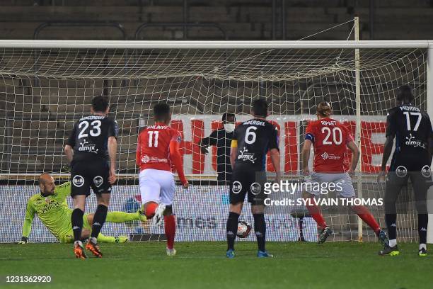 Nimes' French forward Renaud Ripart scores during the French L1 football match between Nimes Olympique and FC Lorient at the Costieres Stadium in...