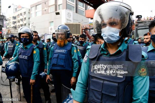 Police officers confront protesters at Dhakas Science lab intersection road during the demonstration. Thousands of students from seven colleges and...