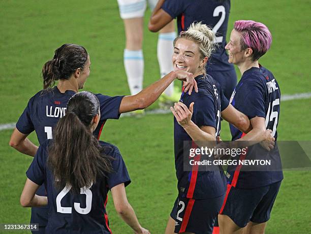 Midfielder Kristie Mewis celebrates with teammates after scoring a goal against Argentina during the first half of their SheBelieves Cup...