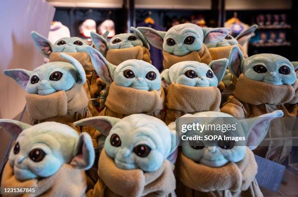 Disney's Star Wars merchandise stuffed toys depicting Grogu character, commonly known as Baby Yoda, from the Disney+ TV series The Mandalorian are...