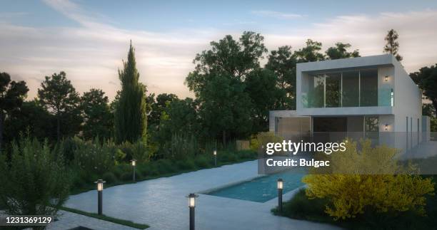 modern minimalist villa (evening) - garden lighting stock pictures, royalty-free photos & images