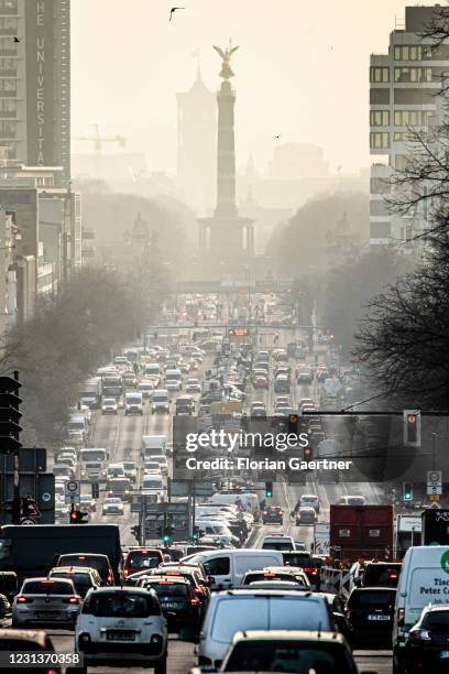 The morning rush hour on the street Bismarckstrasse is pictured during morning light on February 25, 2021 in Berlin, Germany.