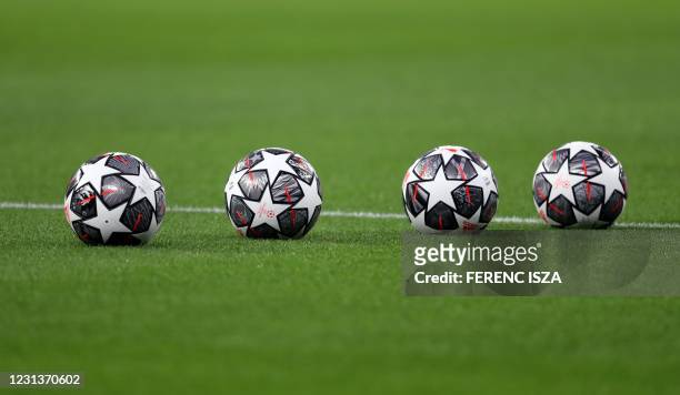 Official balls of the UEFA Champions League lie on the frass prior to the UEFA Champions League, last 16, 1st-leg football match Borussia...