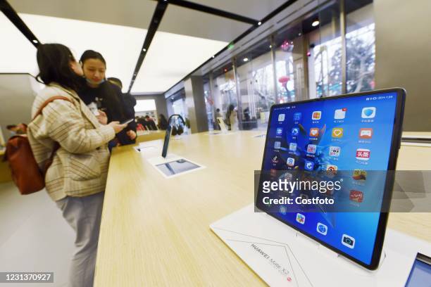 Customer experiences the new foldable phone Mate X2 at Huawei's flagship store in Hangzhou, east China's Zhejiang Province, Feb 25, 2021.-