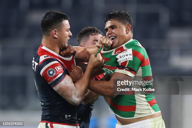 Joseph Manu of the Roosters and Latrell Mitchell of the Rabbitohs scuffle during the round three NRL match between the Sydney Roosters and the South...