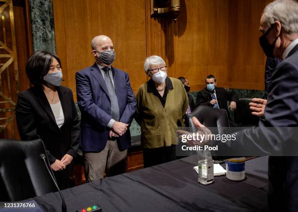 Katherine C. Tai, left, of the District of Columbia, greets Sen. Tom Carper before the Senate Finance Committee hearing at the US Capitol on February...