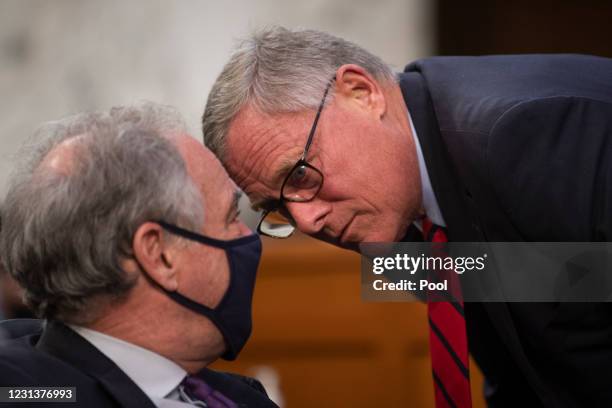 Sen. Tim Kaine and Sen. Richard Burr talk at the confirmation hearing for Vivek Murthy and Rachel Levine before the Senate Health, Education, Labor,...