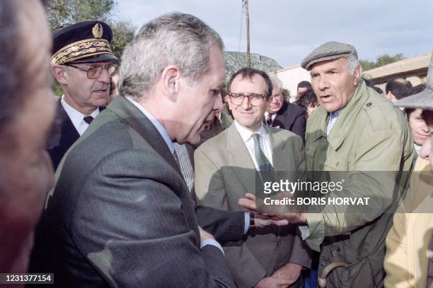 French Secretary of State for rapatriates Laurent Cathala meets harkis during a visit in Jouques on December 5, 1992.