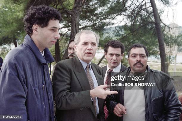 French Secretary of State for rapatriates Laurent Cathala meets harkis during a visit in Jouques on December 5, 1992.