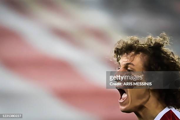 Arsenal's Brazilian defender David Luiz reacts during the UEFA Europa League 32 Second Leg football match between Arsenal and Benfica at the...