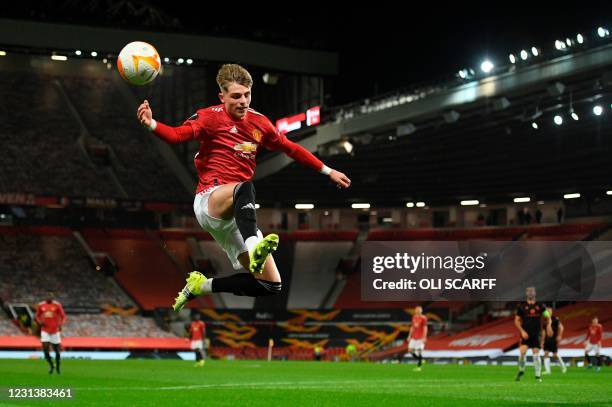 Manchester United's English defender Brandon Williams leaps for the ball but doesn't reach it during the UEFA Europa League Round of 32, 2nd leg...