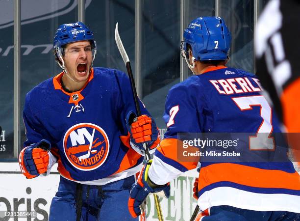 Mathew Barzal of the New York Islanders is congratulated by Jordan Eberle after scoring a goal against the Boston Bruins during the first period at...