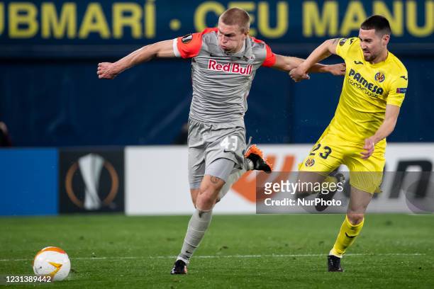 Rasmus Kristensen of FC RB Salzburgo in action against Villarreal's Moises Gomez Bordonado during Europa League match round of 32 Second leg between...