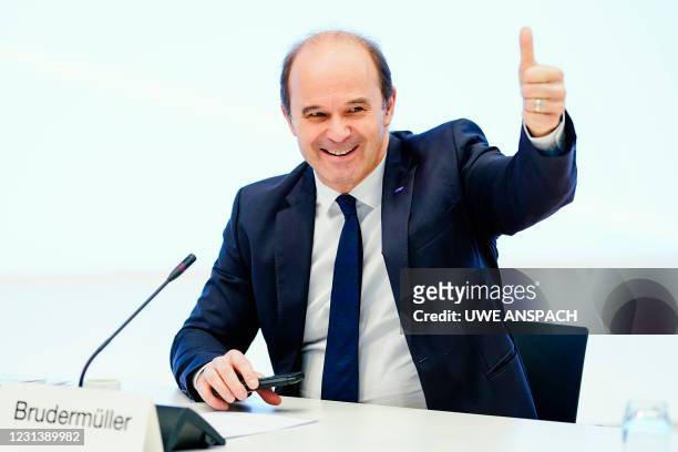 Martin Brudermueller, CEO of German chemicals company BASF, gives a thumb up prior to the company's annual results presentation on February 26, 2021...